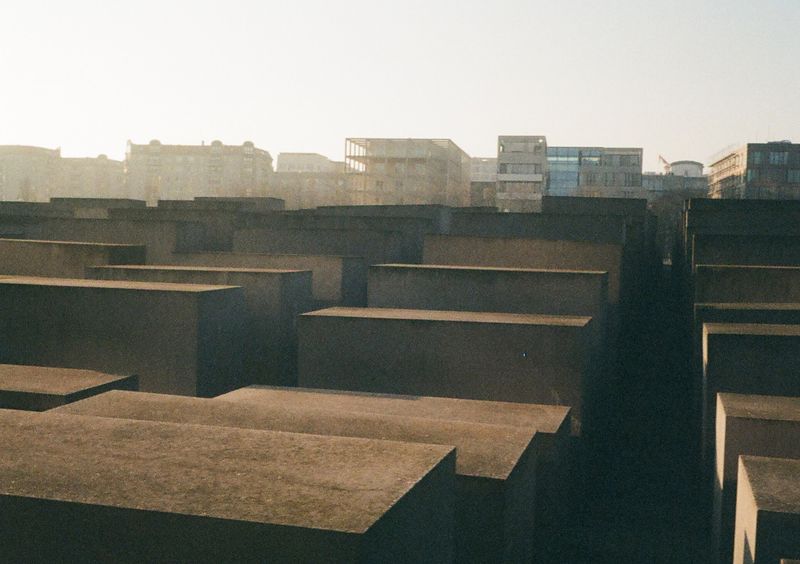 Stone blocks of different sizes arrange in a grid pattern, taken in the early morning glow.