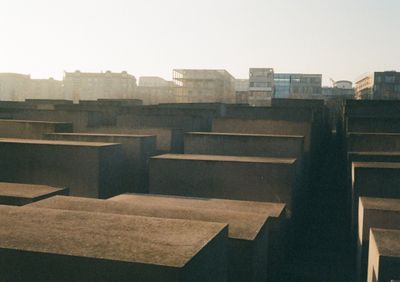 Stone blocks of different sizes arrange in a grid pattern, taken in the early morning glow.